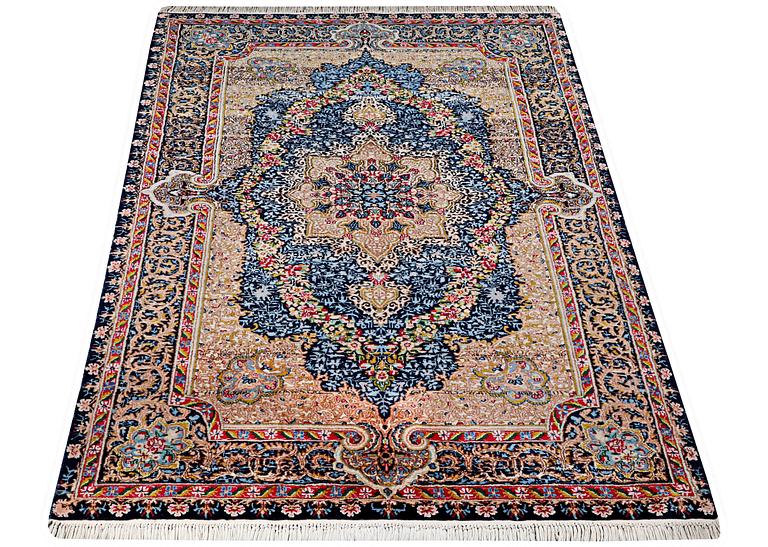 A Kerman Laver carpet, c. 252 x 150 cm.