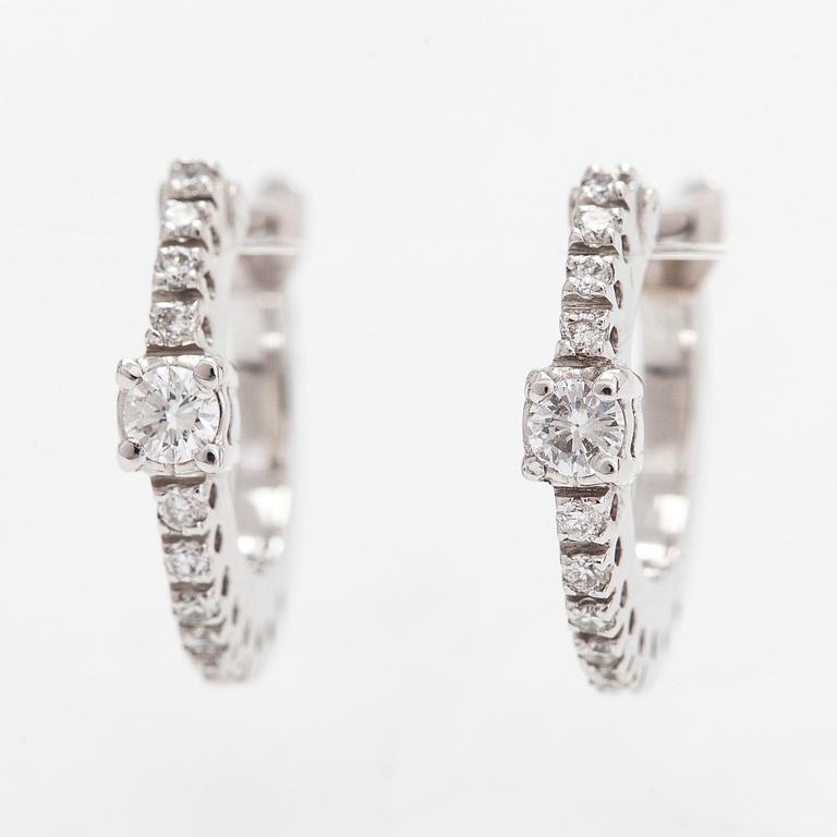 A pair of 18K white gold earrings, with diamonds totalling approx 0.18 ct. Italy.