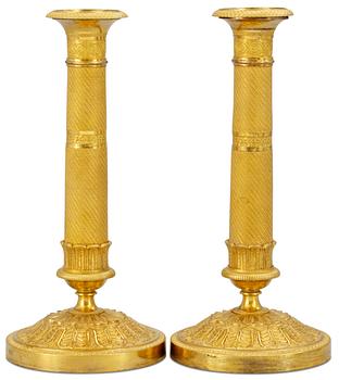 1045. A pair of Empire candlesticks.