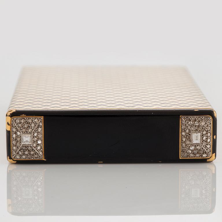 A Cartier Art Deco Vanity Case in 18K gold with enamel and baguette- and rose-cut diamonds.