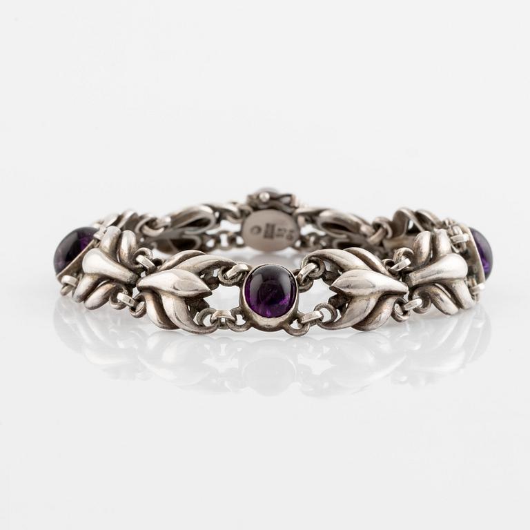 Georg Jensen, a silver bracelet set with cabochon-cut amethysts.