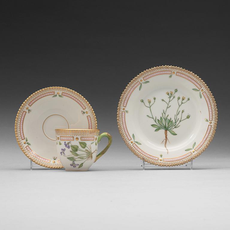 A set of eight cups with stands and six dessert dishes, Royal Copenhagen, 'Flora Danica', 20th Century.