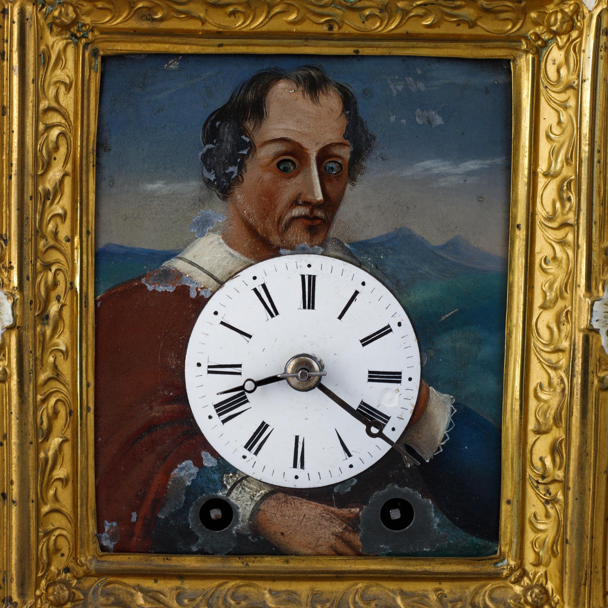 A Schwarzwald area wall pendulum clock with mechanical eye-movment, mid 19thcentury.