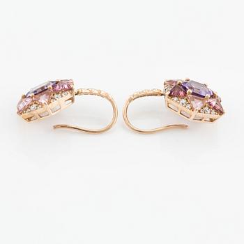 Earrings with amethysts, pink tourmalines, and brilliant-cut diamonds.
