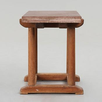 Axel Einar Hjorth, a red limestone top and stained pine side table, Nordiska Kompaniet, Sweden 1929.