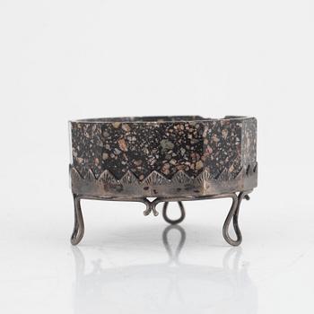 An early 19th century 'Orrlok' porphyry salt with a silver stand,  mark of C. L. Nordström, Uddevalla 1897.