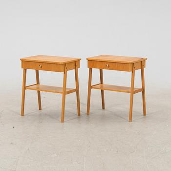 A pair of veneered bedside tables, 1950's/60's.