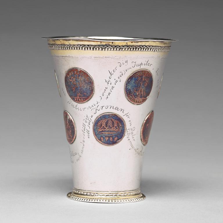 A Swedish 18th century parcel-gilt silver beaker with copper coins, mark of CM Ekman, Eksjö (1729-1738).