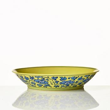 A large yellow ground underglaze blue peach dish, Qing dynasty, Qianlong six character mark (1736-1795).