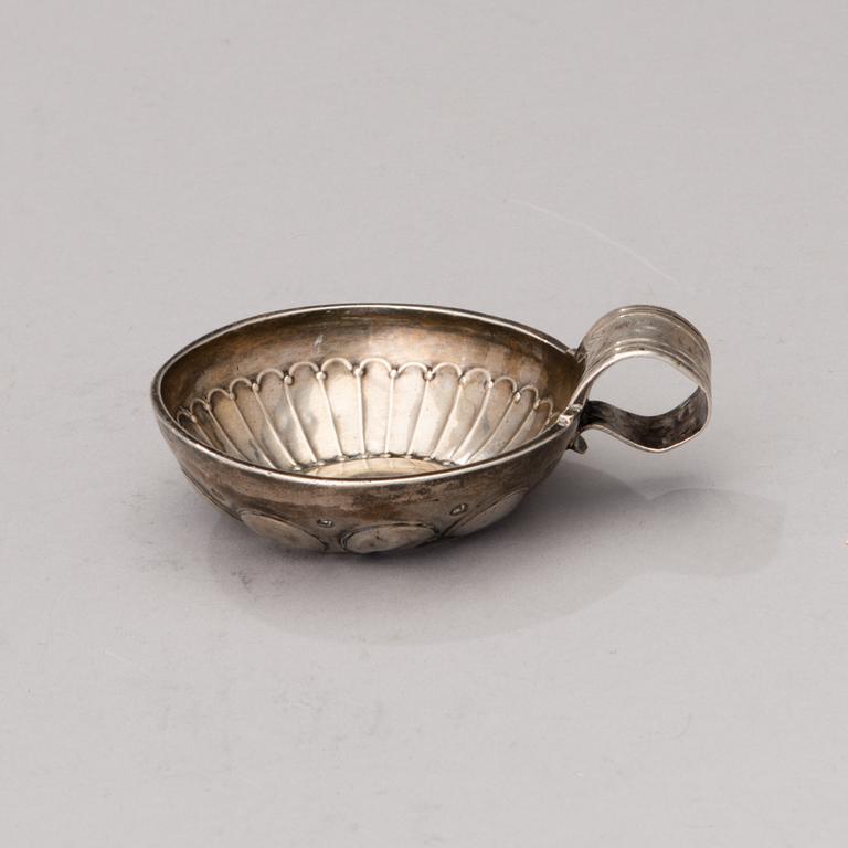 A French silver tastevin marked J.G, 1819-1838.