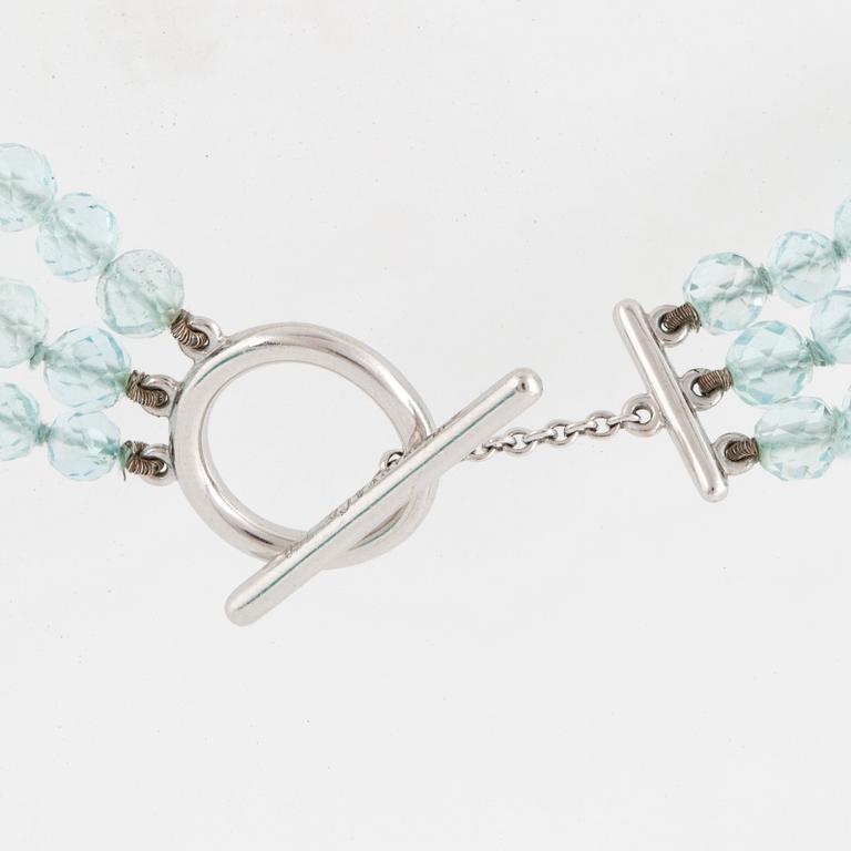 A Tiffany & Co three strand faceted aquamarine bead necklace with an 18K white gold clasp.