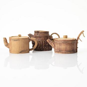 A group of three bright yellow yixing 'Gongfu' teapots, China, 1990s.