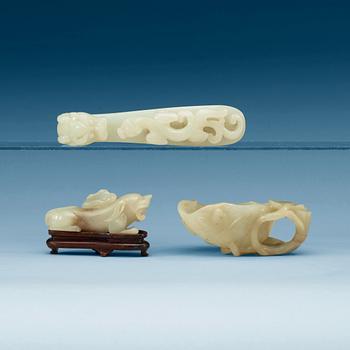 1408. A Chinese nephrite belt hook, figure and a brush washer.
