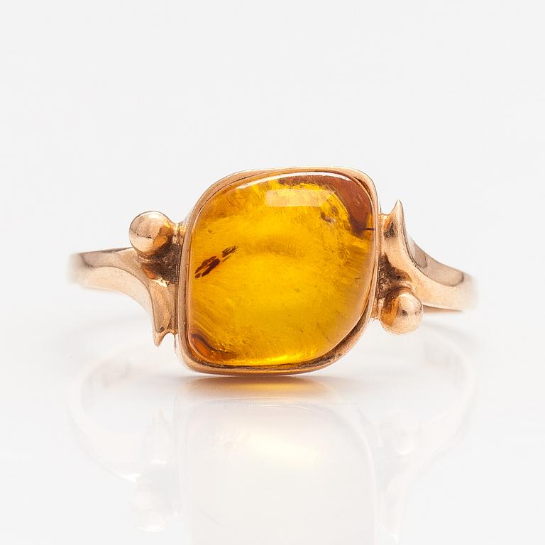 A 14K gold ring with an amber. Sovjet union.