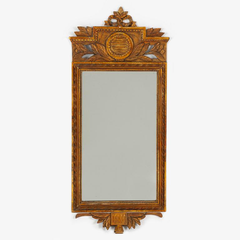 An Empire style mirror, around the year 1900.