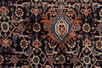 An oriental rug, approx. 203 x 135 cm.