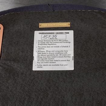 A Tom Dixon "Wingback Dining Chair" from Tom Dixon.