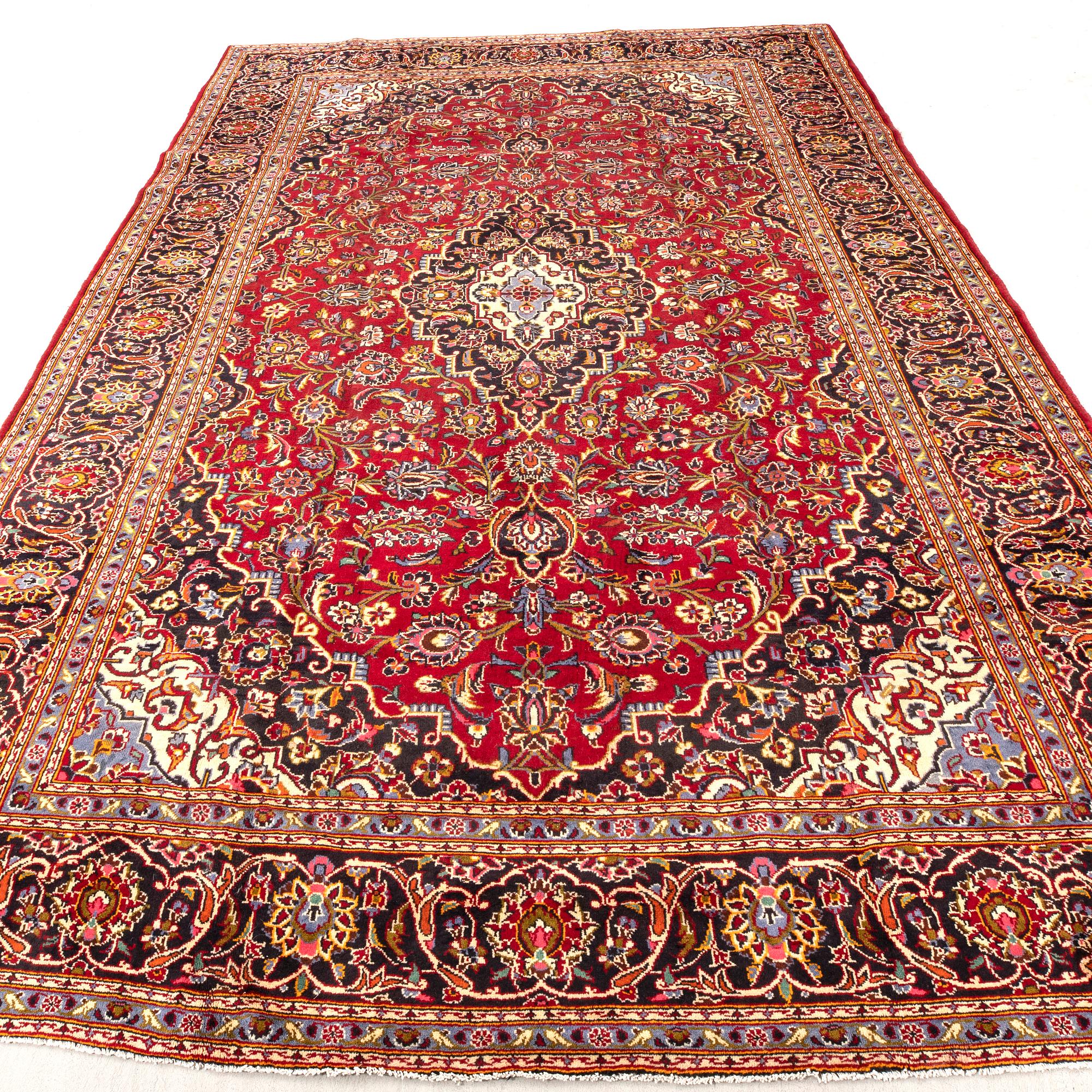 An old Kashan carpet approx 388x270 cm.