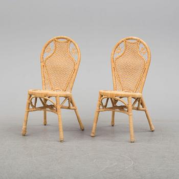 A pair of second half of the 20th cnetury rattan chairs.