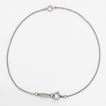 Tiffany & Co, Elsa Peretti, a platinum 'Diamonds by the Yard' bracelet with a brilliant-cut diamond.