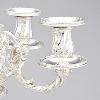 A pair of Swedish silver candelabra, mark of Gustaf Möllenborg (Carl Teodor Feron), Stockholm 1896.