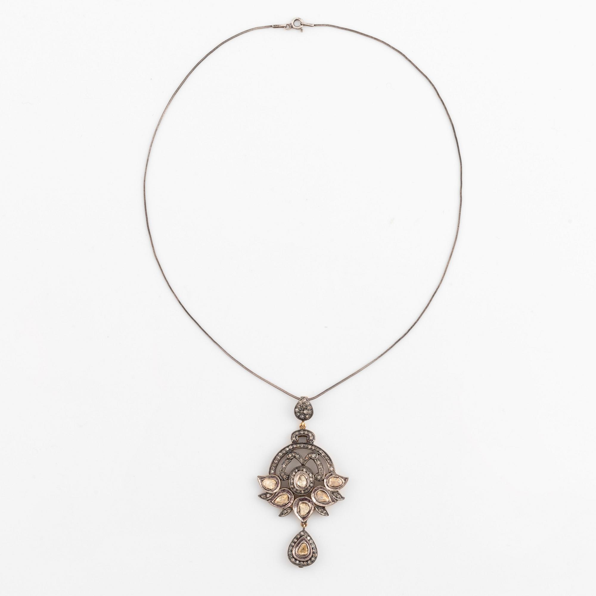 A faceted diamond necklace.