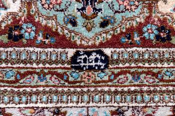 A semiantique signed Tabris carpet ca 364x262 cm.