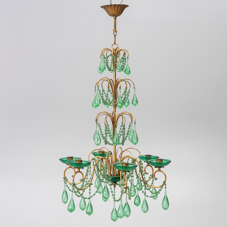 A chandelier, likely from Italy, circa 1950.