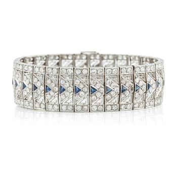 A platinum bracelet with old-cut diamonds and sapphires, likely Bucherer.