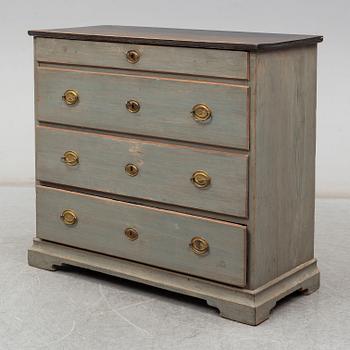 a chest of drawers from the first half of the 19th century.