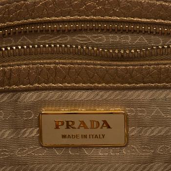 A Prada leather handbag.