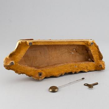 A 19th-century rococo-revival ormolu mantle clock.