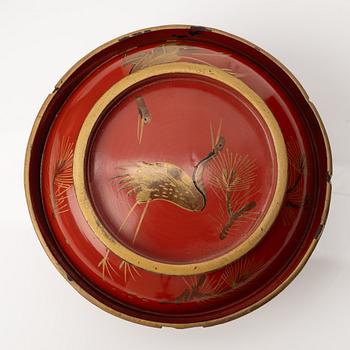 A group of nine Japanese lacquer bowls with covers, Meiji and 20th century.