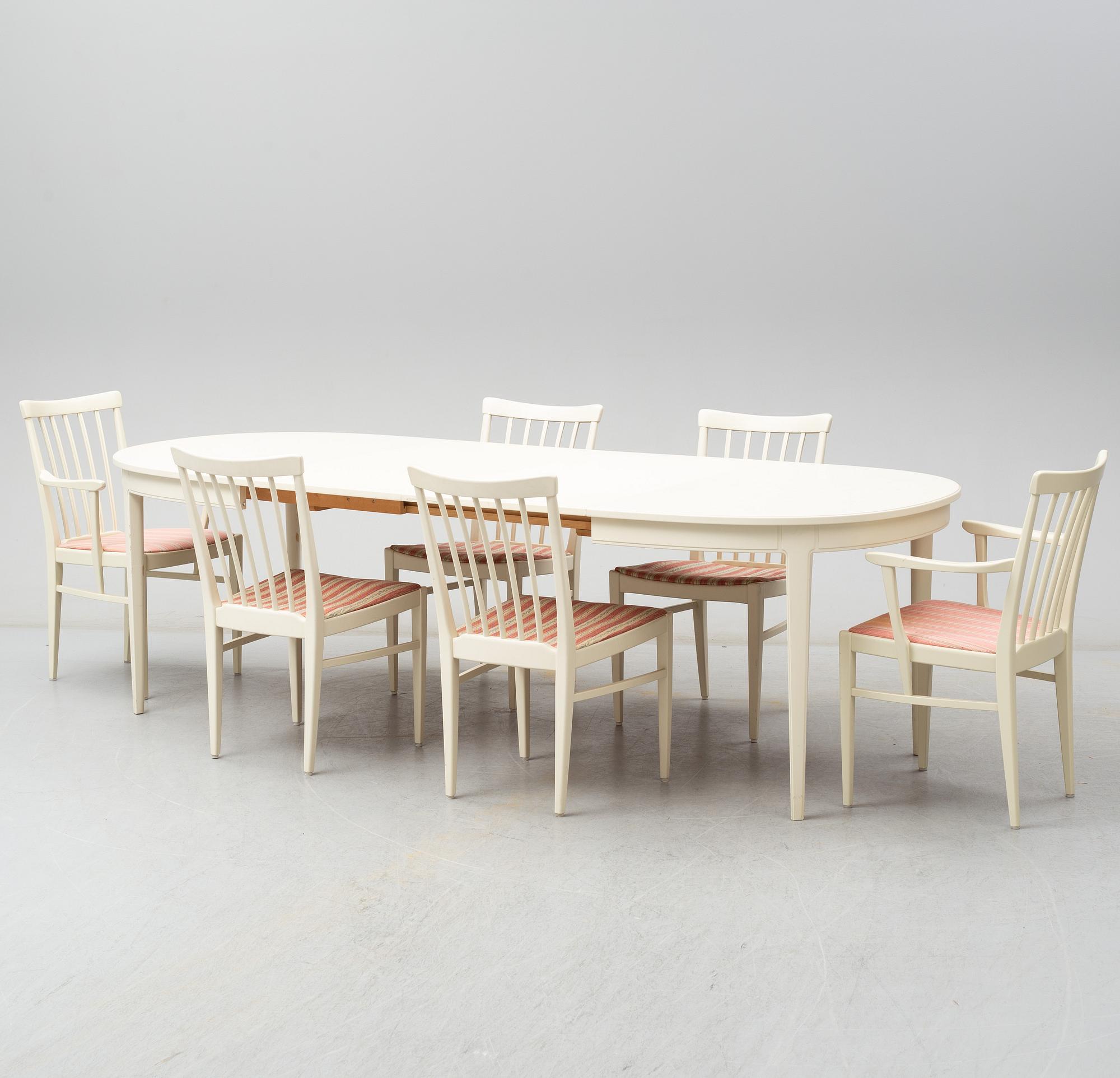 A dining table with four chairrs and two armchairs by Carl Malmsten from Åfors.