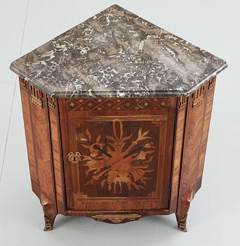 A late 18th Century Louis XVI encoignure stamped by Martin Ohneberg.