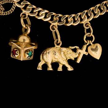 ARMBAND, 18k guld, med berlocker. Segir AB, Köping 1946. Vikt ca 30g.