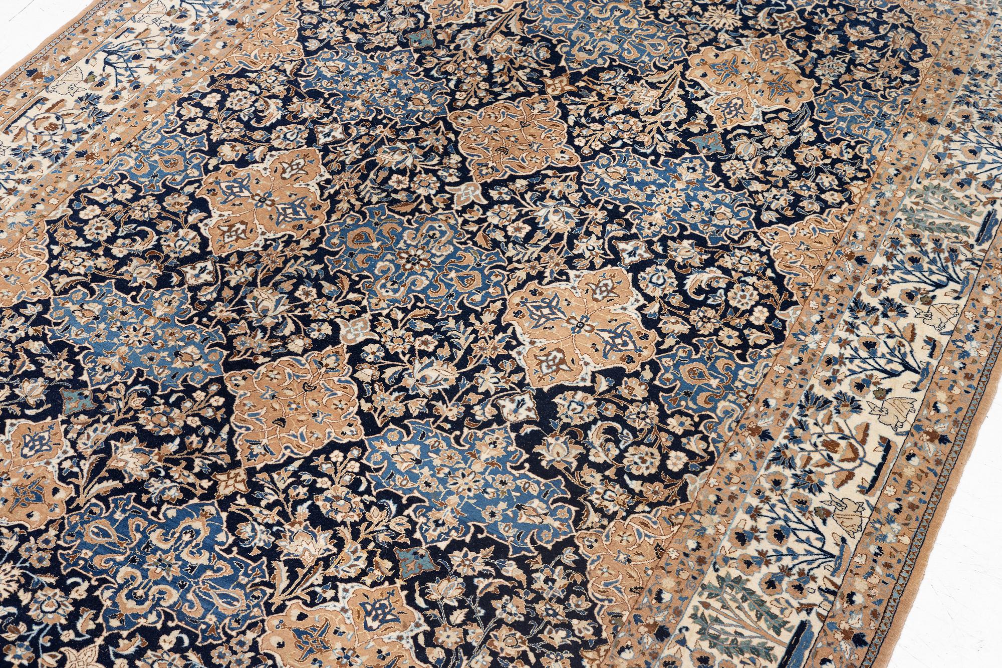A semi-antique Nain carpet, part-silk, c. 261 x 175 cm.