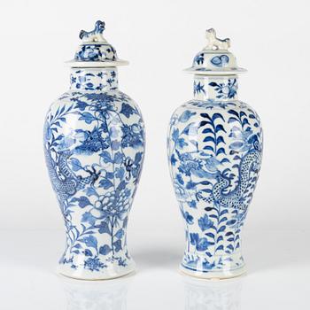 Two Chinese blue and white vases with covers, late Qing dynasty.