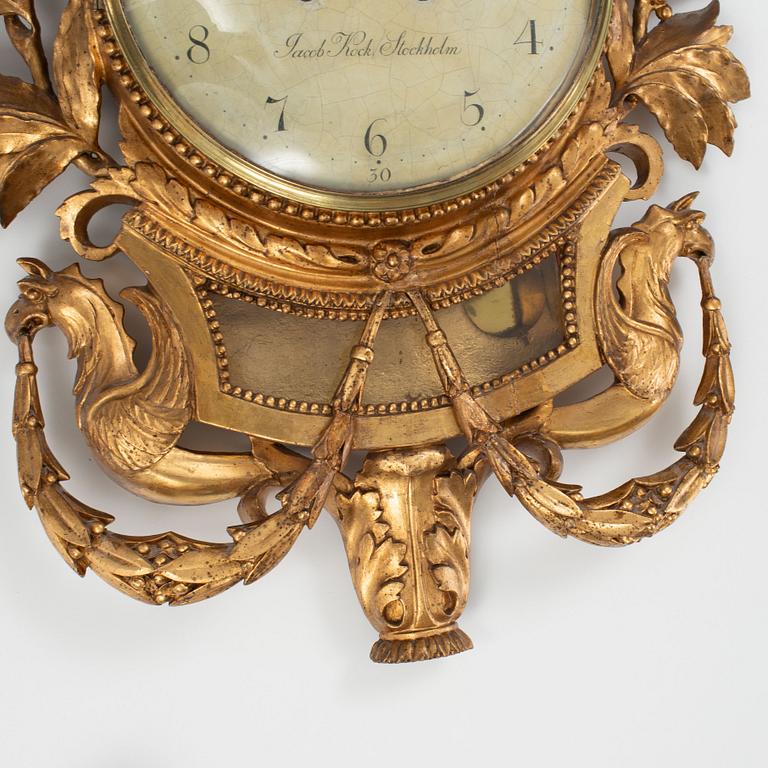 A late Gustavian carved and giltwood cartel clock by J. Kock (royal watchmaker, active 1762-1803).