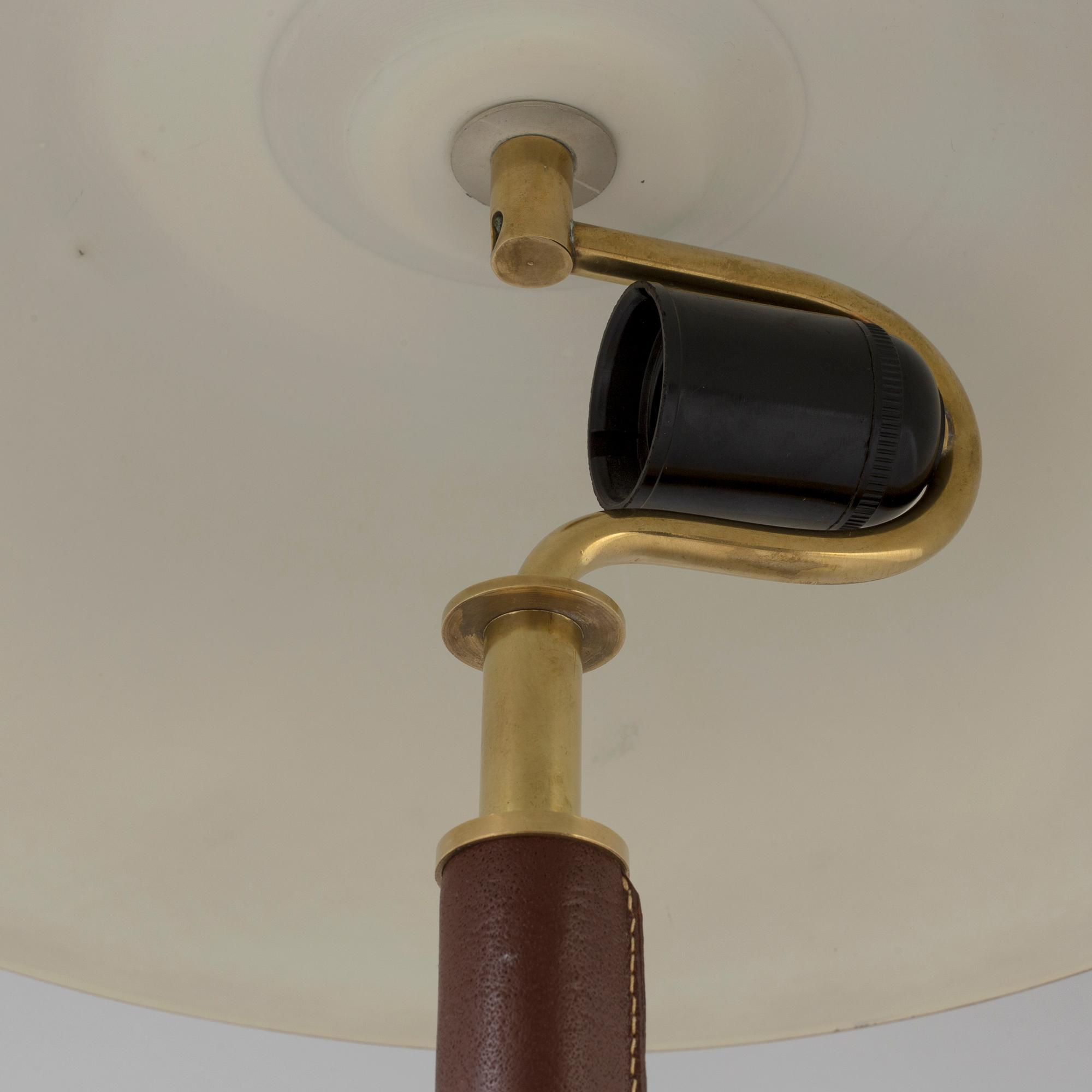 A brass and leather table light from Falkenbergs Belysning, second half of the 20th Century.