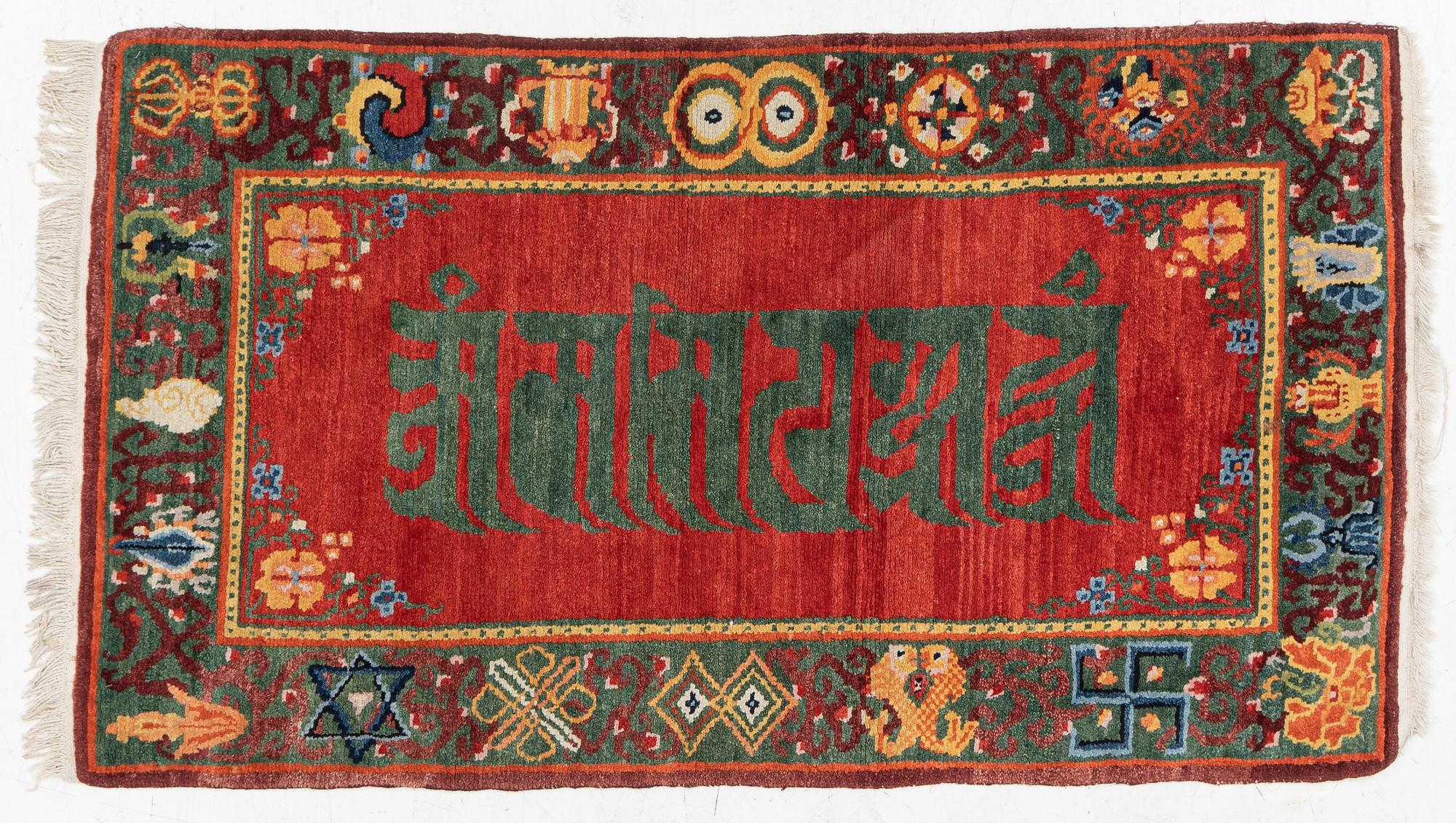 A Nepalese rug, c. 157 x 91cm.
