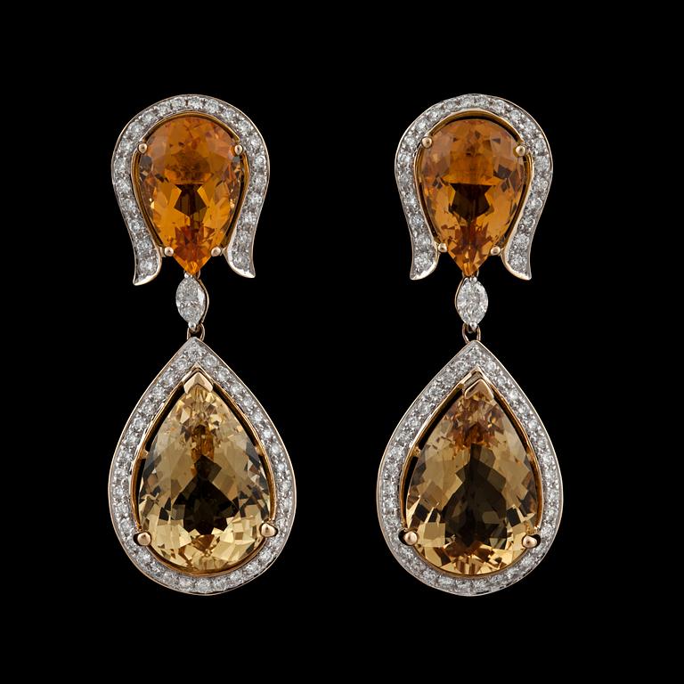 A pair of citrine, yellow beryl and diamond earrings.