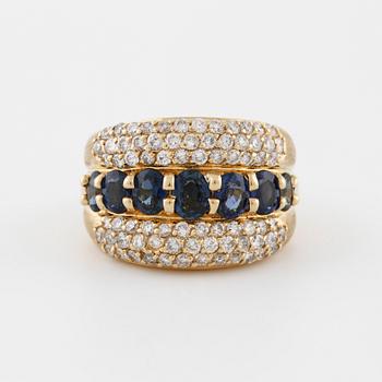 A oval cut sapphire and brilliant cut diamond ring.