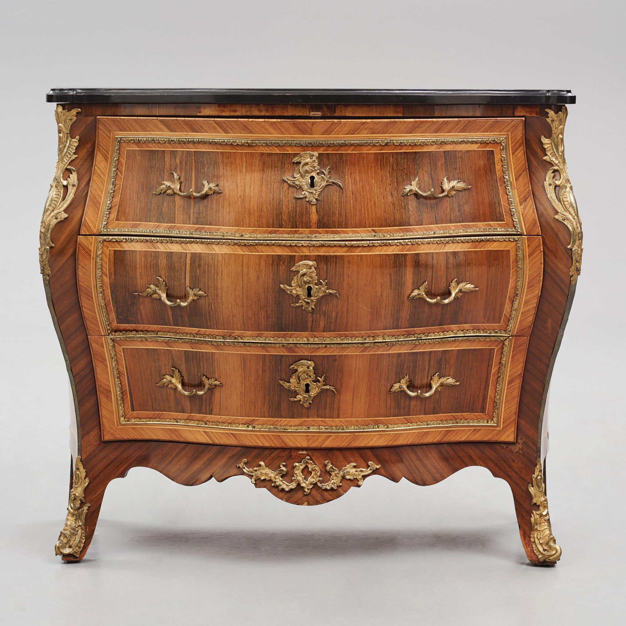 A rococo parquetry and gilt brass-mounted commode possibly by C. Åhman (master in Stockholm 1748-1783).