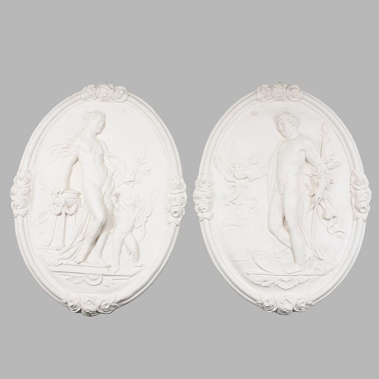 VÄGGRELIEFER, 2 st, gips, 1900-tal.