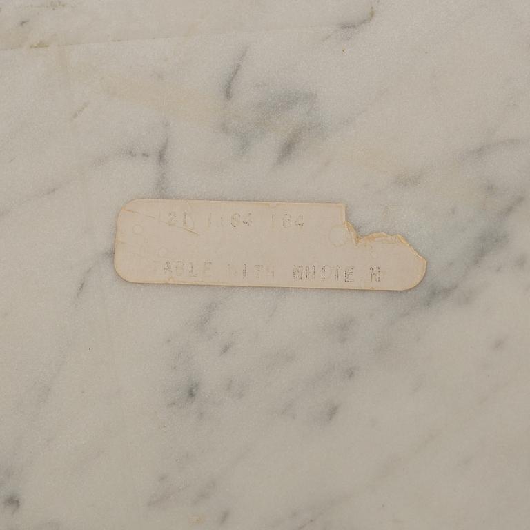 Eero Saarinen, a "Tulip" dining table with four chairs, 1970's.