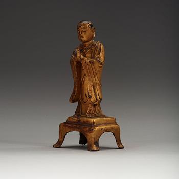 A lacquered gilt figure of a standing monk, Ming dynasty (1368-1644).