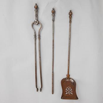 A set of three steel fire irons, 19th century.