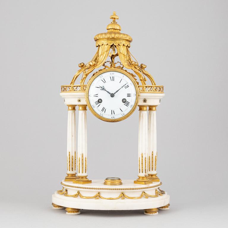 A Louis XVI marble and gilt bronze mantel clock, late 18th Century.