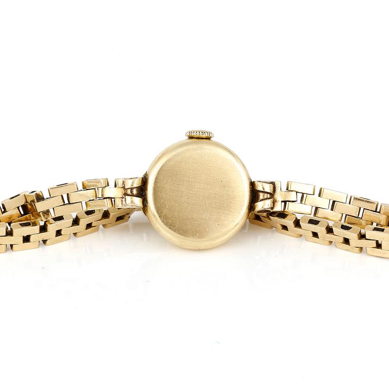 ARMBANDSUR, dam, 18K guld, 'Cyma, CymaFlex' Le Locle, Schweiz 1900-talets mitt. Total vikt ca 18,97 g.